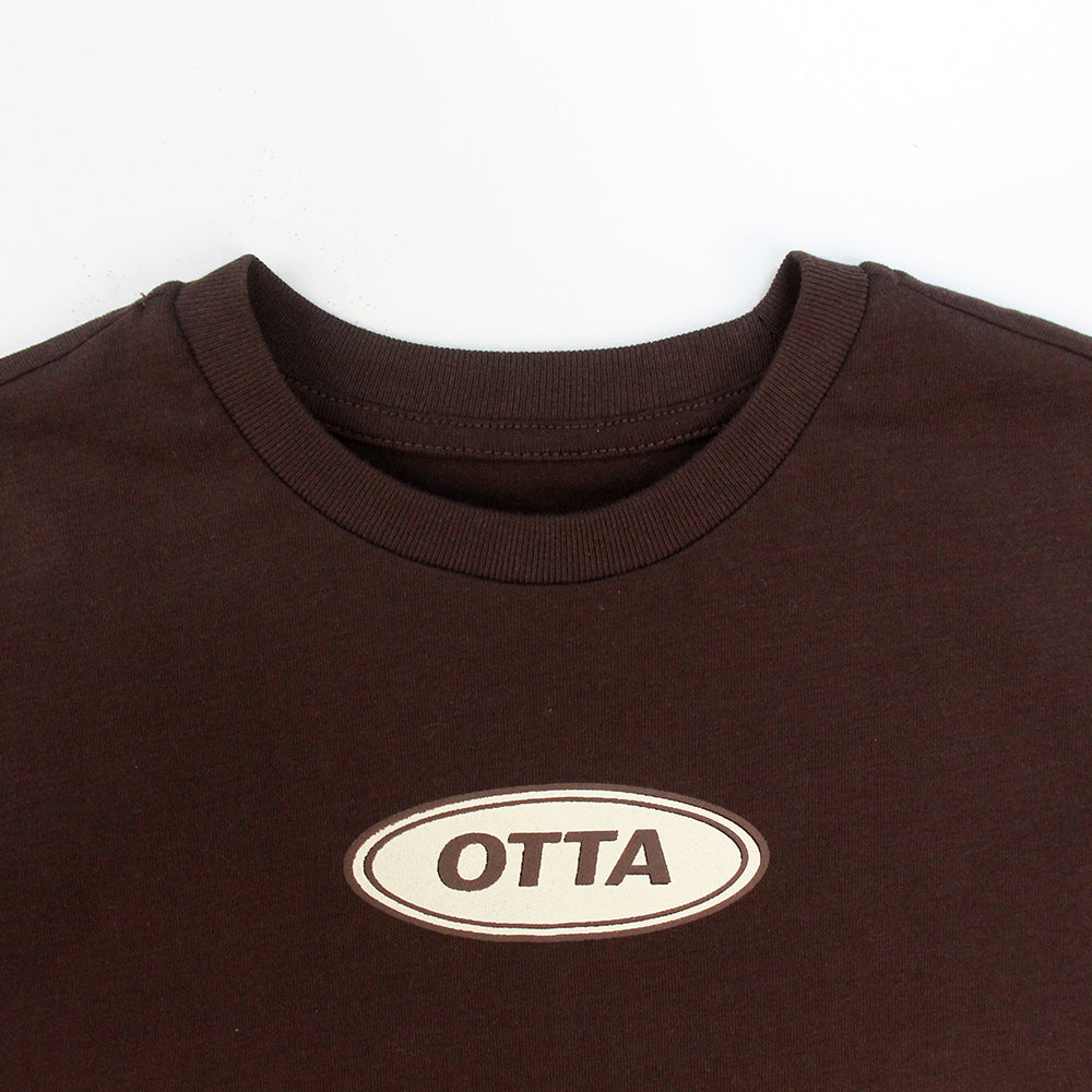 Brown Oval Badge T-Shirt on model — OTTA Kids